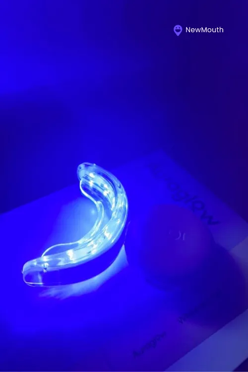 Auraglow whitening LED tray in the dark being charged product shot