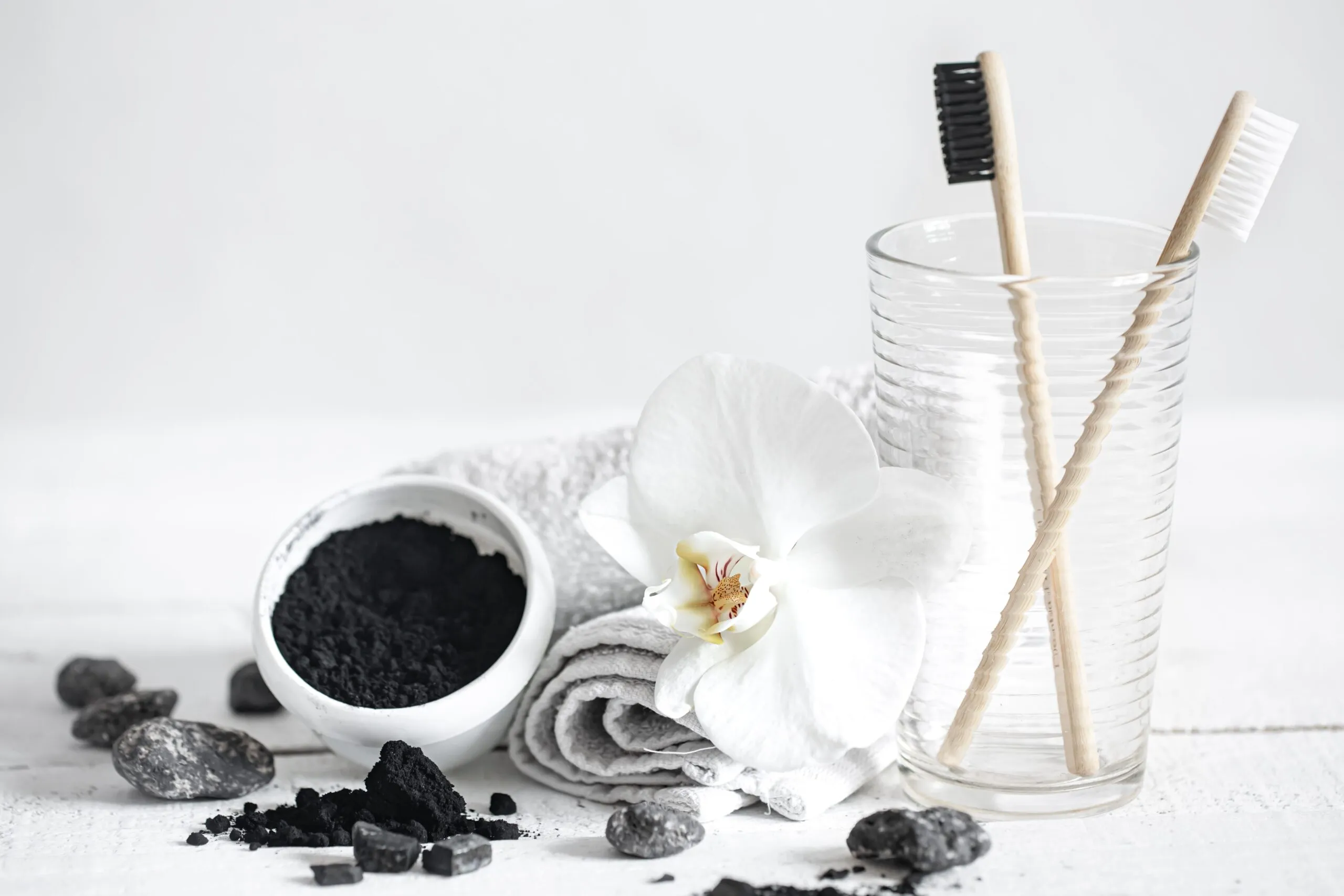Charcoal and charcoal toothbrush with white background