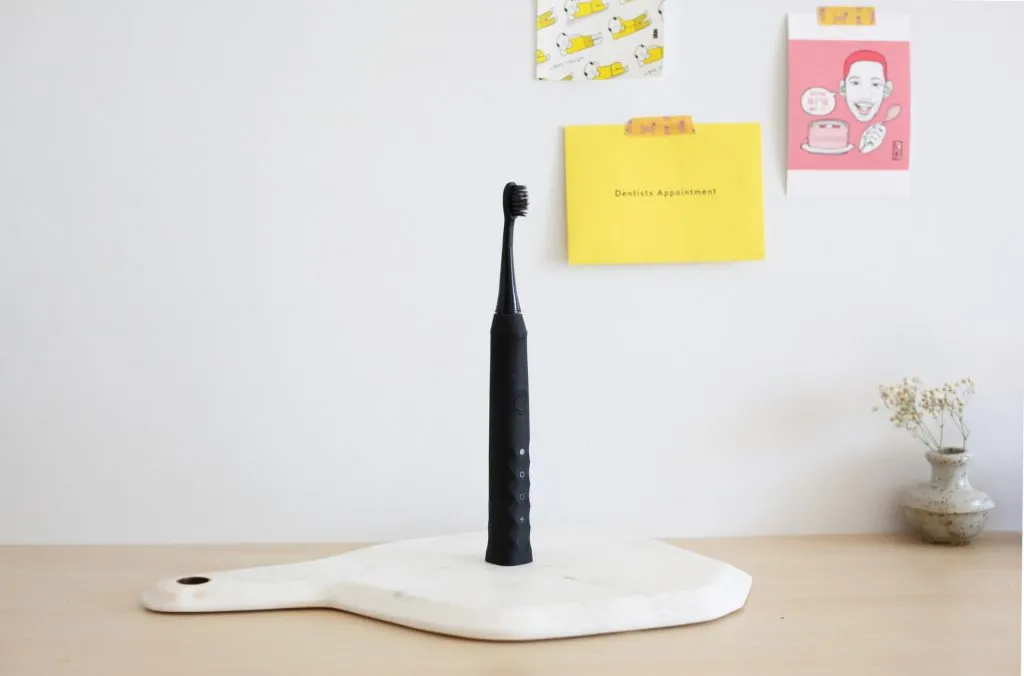 Product shot of black electric toothbrush