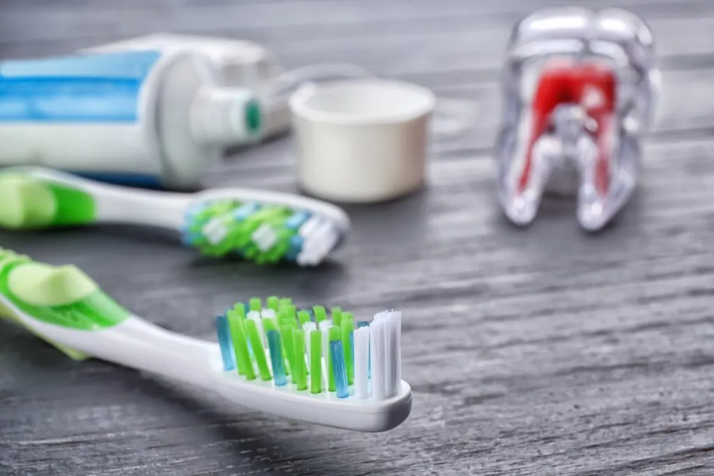 Toothbrushes and toothpaste on a table