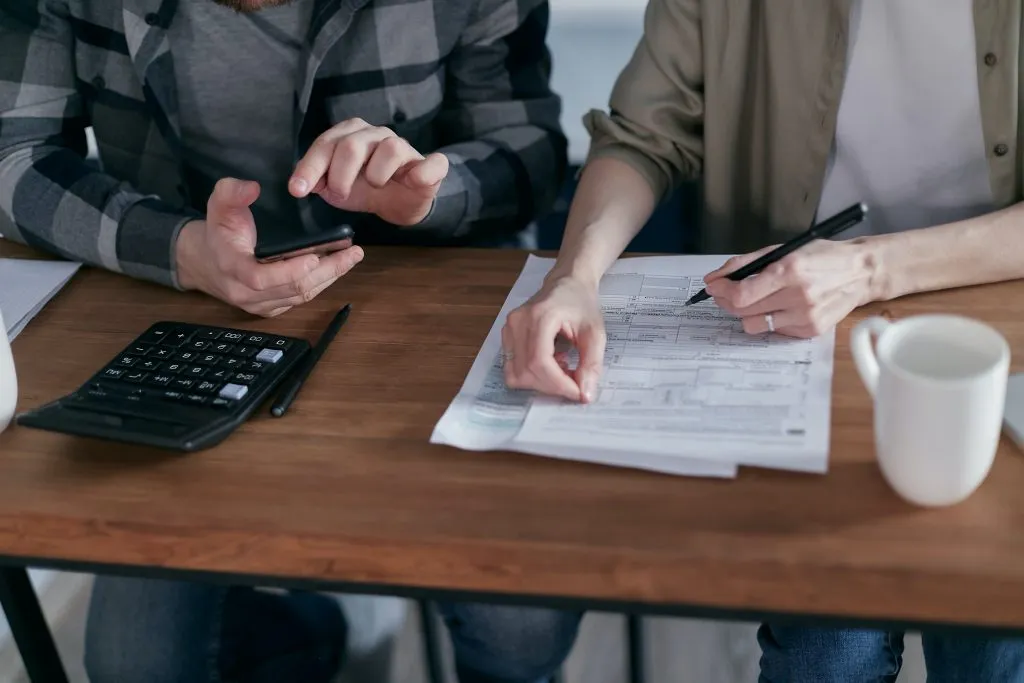 Two people going over documents