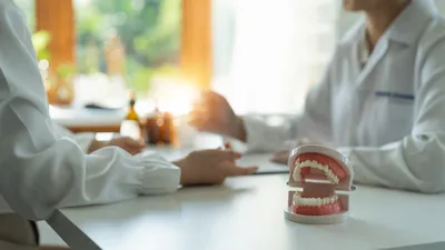 Dentures vs. Implants