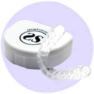 A clear mouthguard is shown alongside its white storage case with the logo "SportingSmiles" on the lid, set against a light purple circle background.
