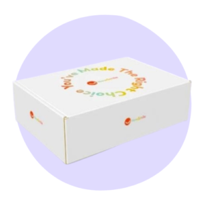 A white rectangular box with colorful text "You've Made The Right Choice" on the lid, set against a light purple circular background.