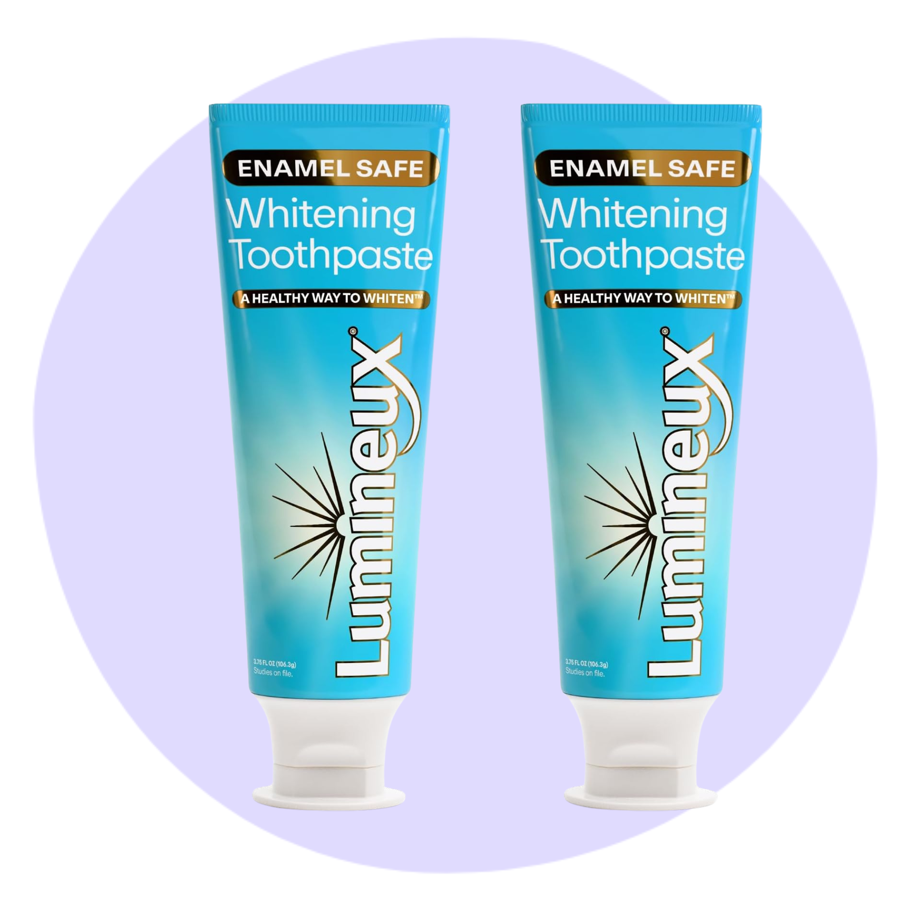 Two tubes of Lumineux Enamel Safe Whitening Toothpaste are displayed upright against a light purple circular background.